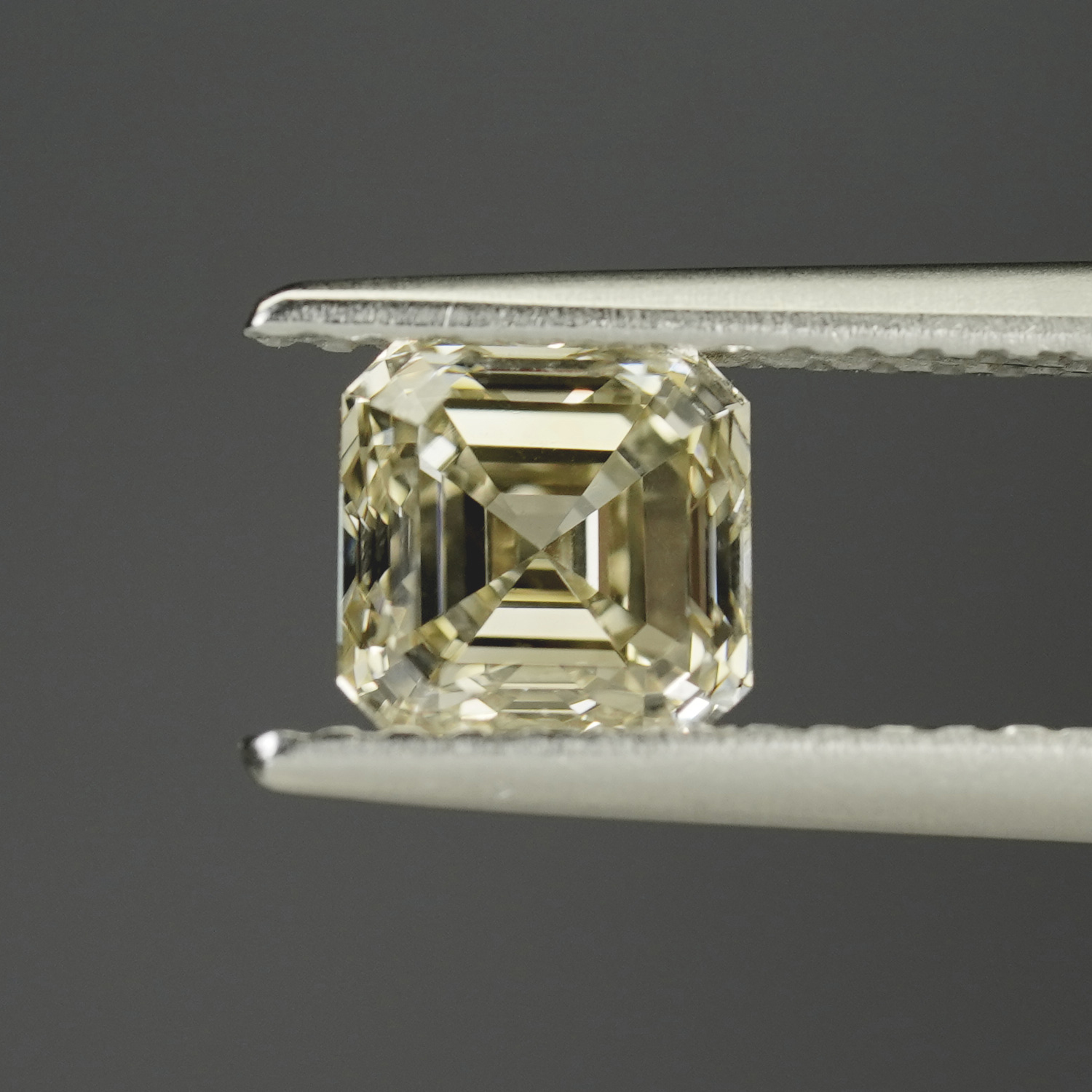 Stunning 1.03CT Fancy Yellow Asscher with Champagne Hints
