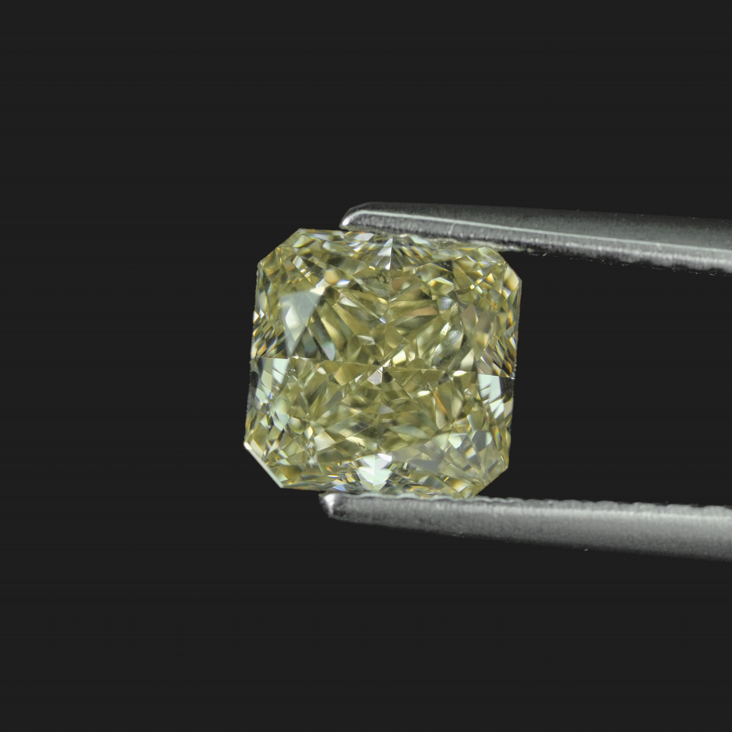 REMARKABLE 1.66CT SQUARE EMERALD FANCY DIAMOND